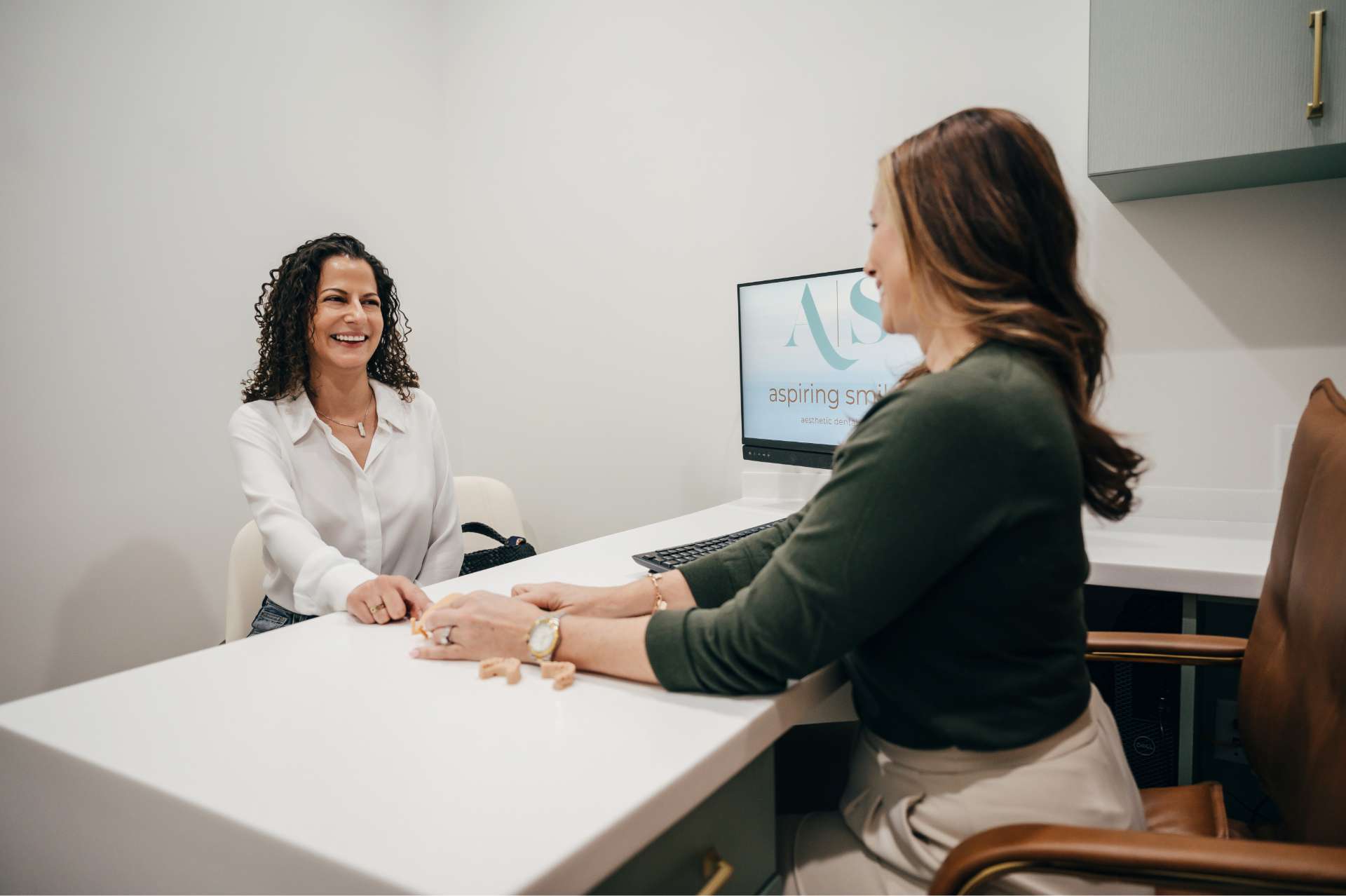 Dr. Gena Pineda with a patient at Aspiring Smiles, Boca Raton